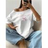 imageSHENHE Womens Off The Shoulder Oversized Bow Graphic Tee Shirt Short Sleeve Y2k TopWhite